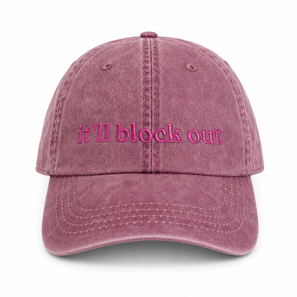 Pink cap with 'it'll block out' text on a white background