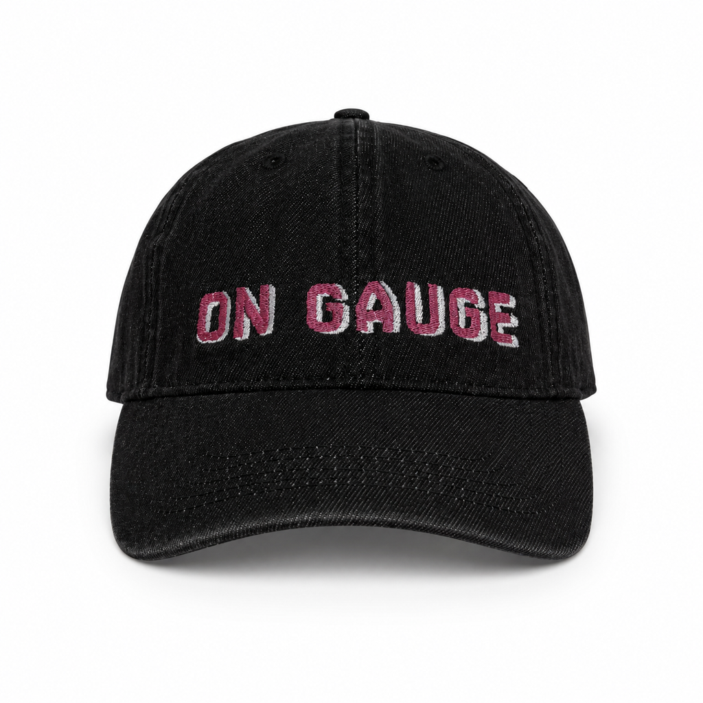Black cap with 'ON GAUGE' text in pink on a white background
