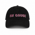 Black cap with 'ON GAUGE' text in pink on a white background