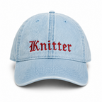 Light blue denim cap with 'Knitter' embroidered in red on a white background