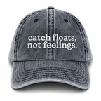 Gray cap with 'catch floats, not feelings' text on a white background