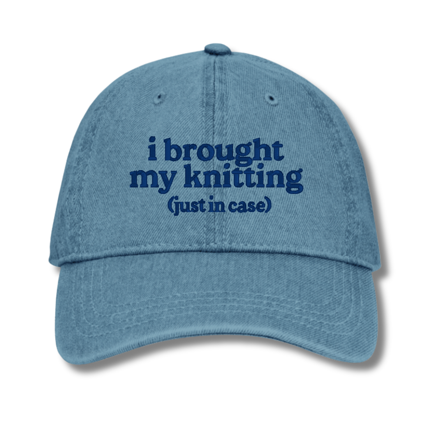 Blue cap with text 'i brought my knitting (just in case)' on a white background