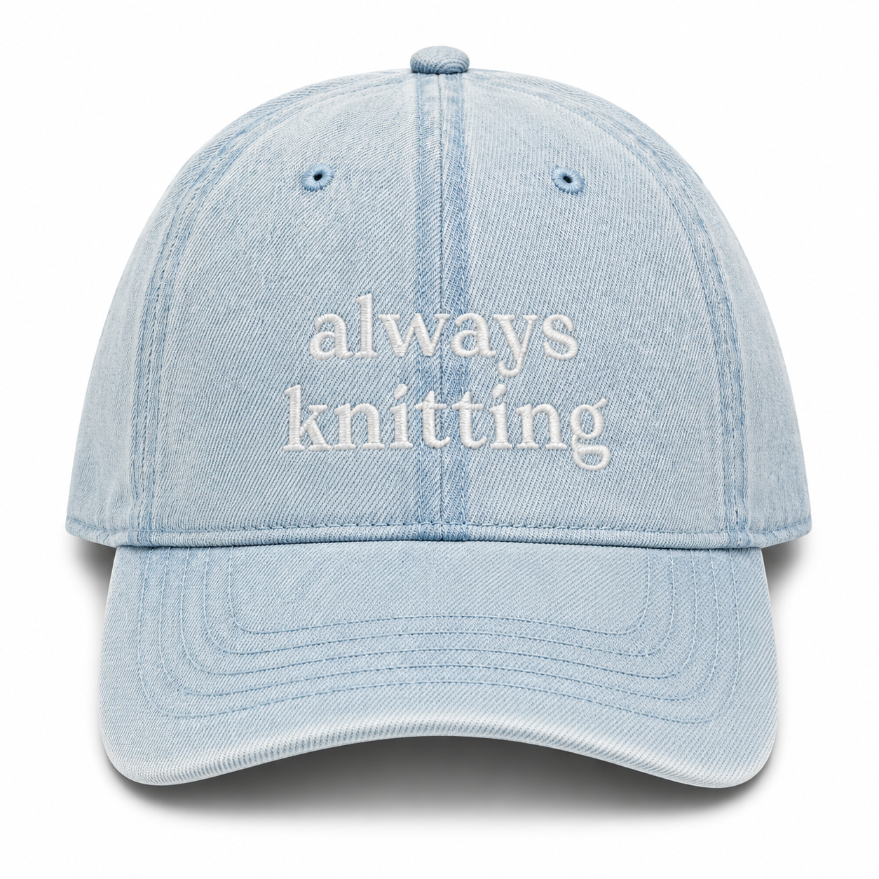 Light blue cap with 'always knitting' text on a white background