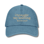 Blue cap with embroidered text on a white background