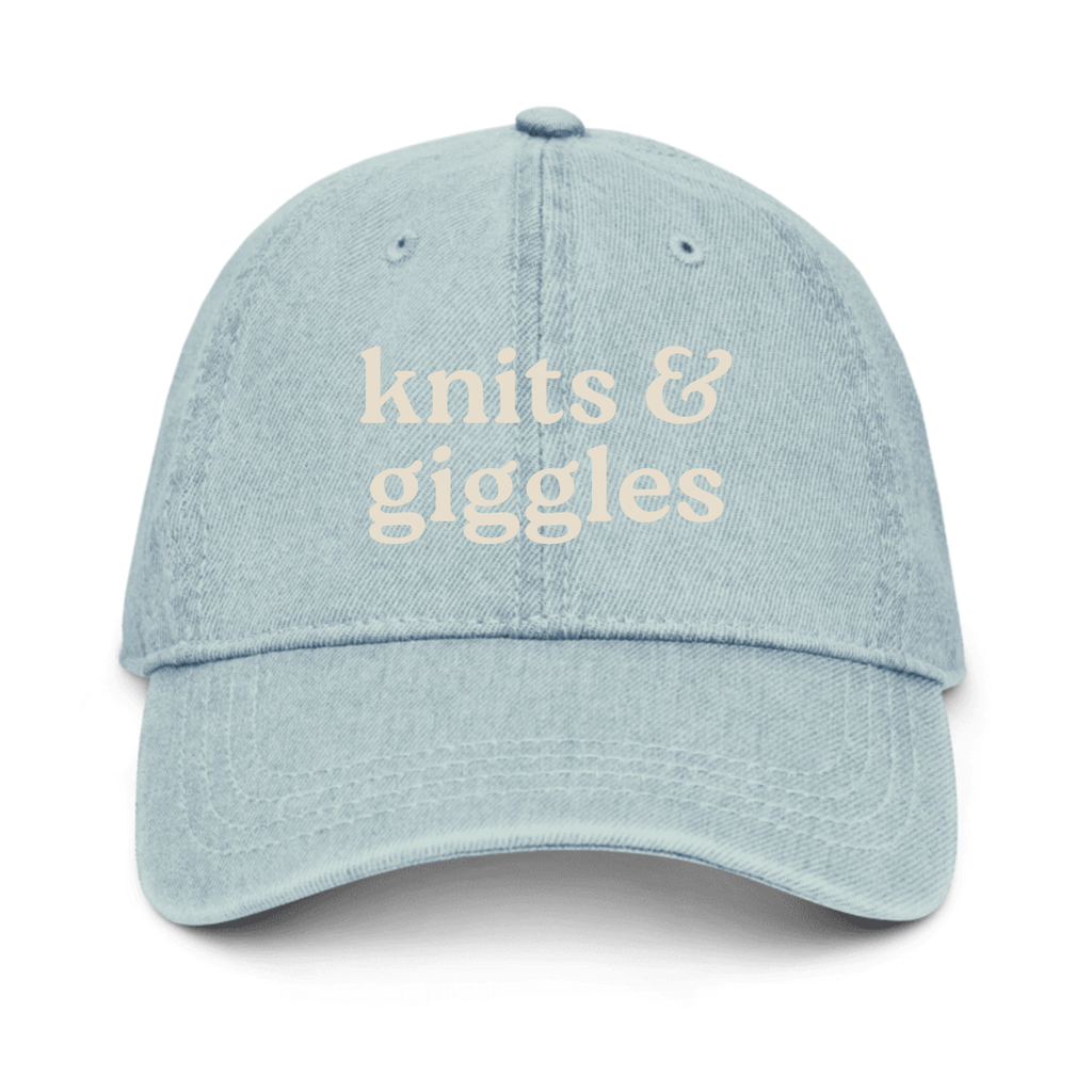 Light blue denim cap with 'knits & giggles' text on a white background