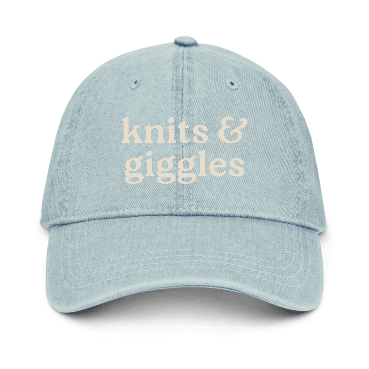Light blue denim cap with 'knits & giggles' text on a white background