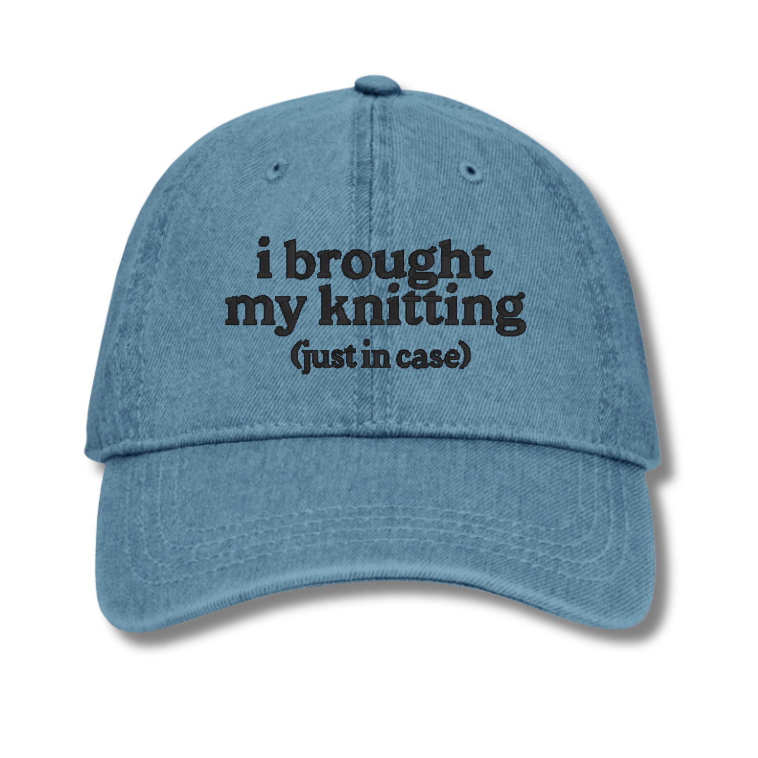 Blue cap with text 'i brought my knitting (just in case)' on a white background