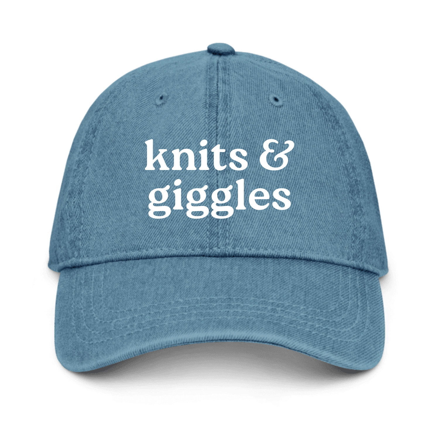 Blue cap with 'knits & giggles' text on a white background