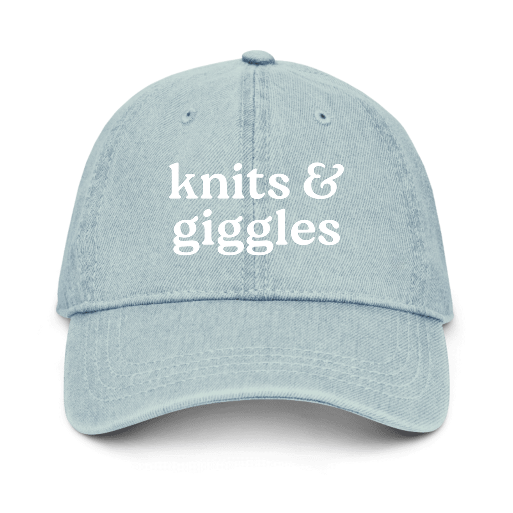 Light blue denim cap with 'knits & giggles' text on a white background
