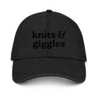 Black cap with embroidered logo on a white background