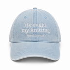 Light blue denim cap with white text on a white background