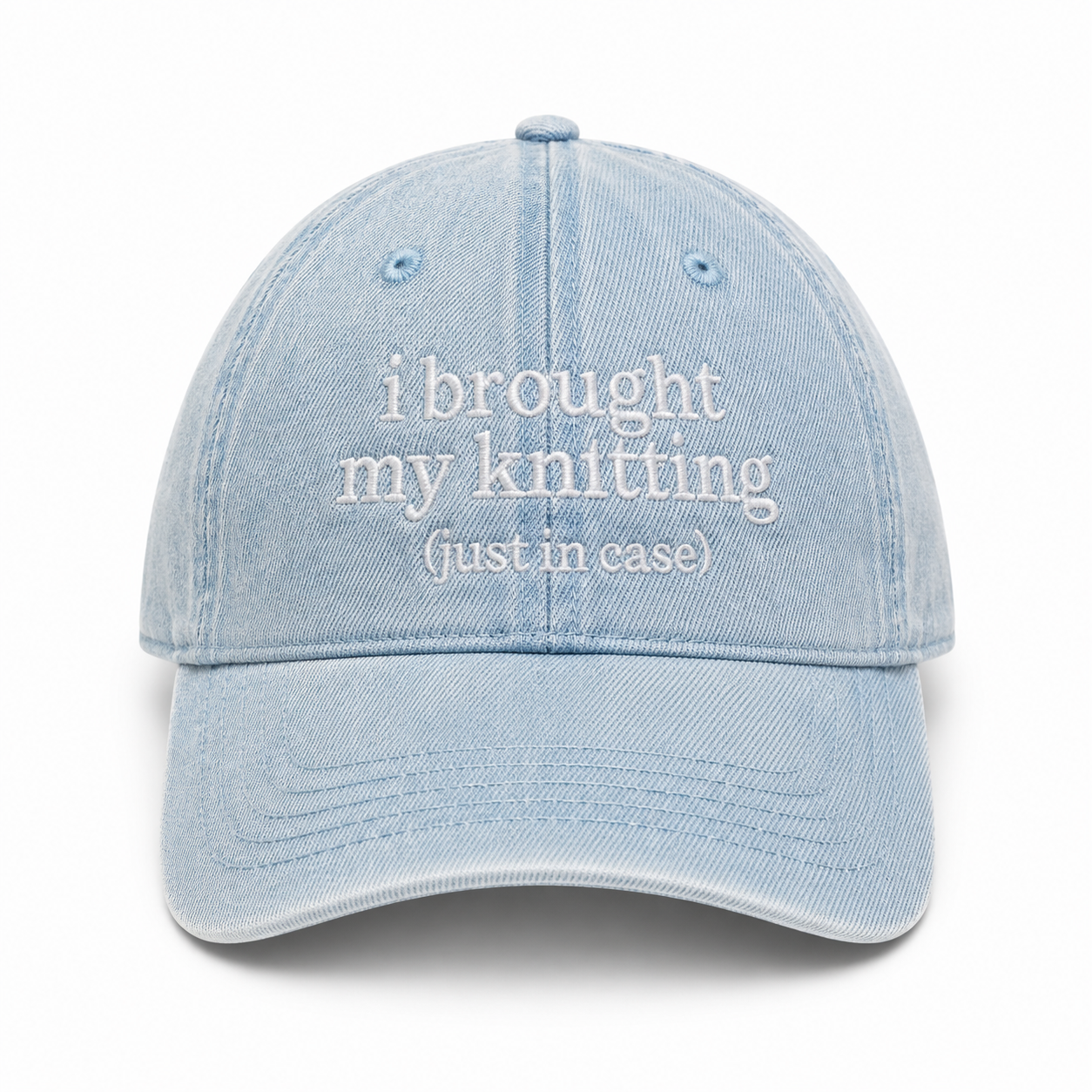 Light blue denim cap with white text on a white background