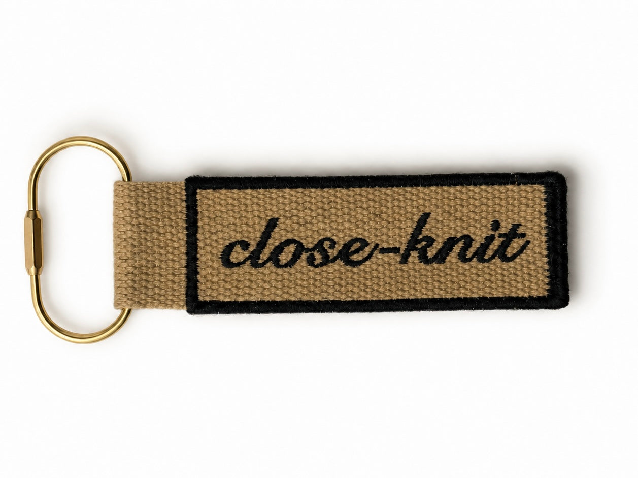 Close-Knit - Beige Bag Charm – Black Embroidery | TIMI