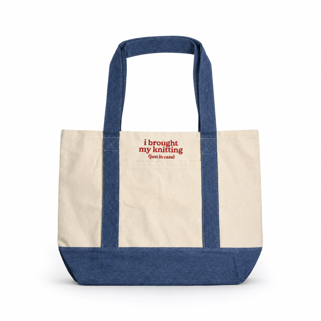 Tote bag with blue handles and bottom, beige body, and red text on a white background