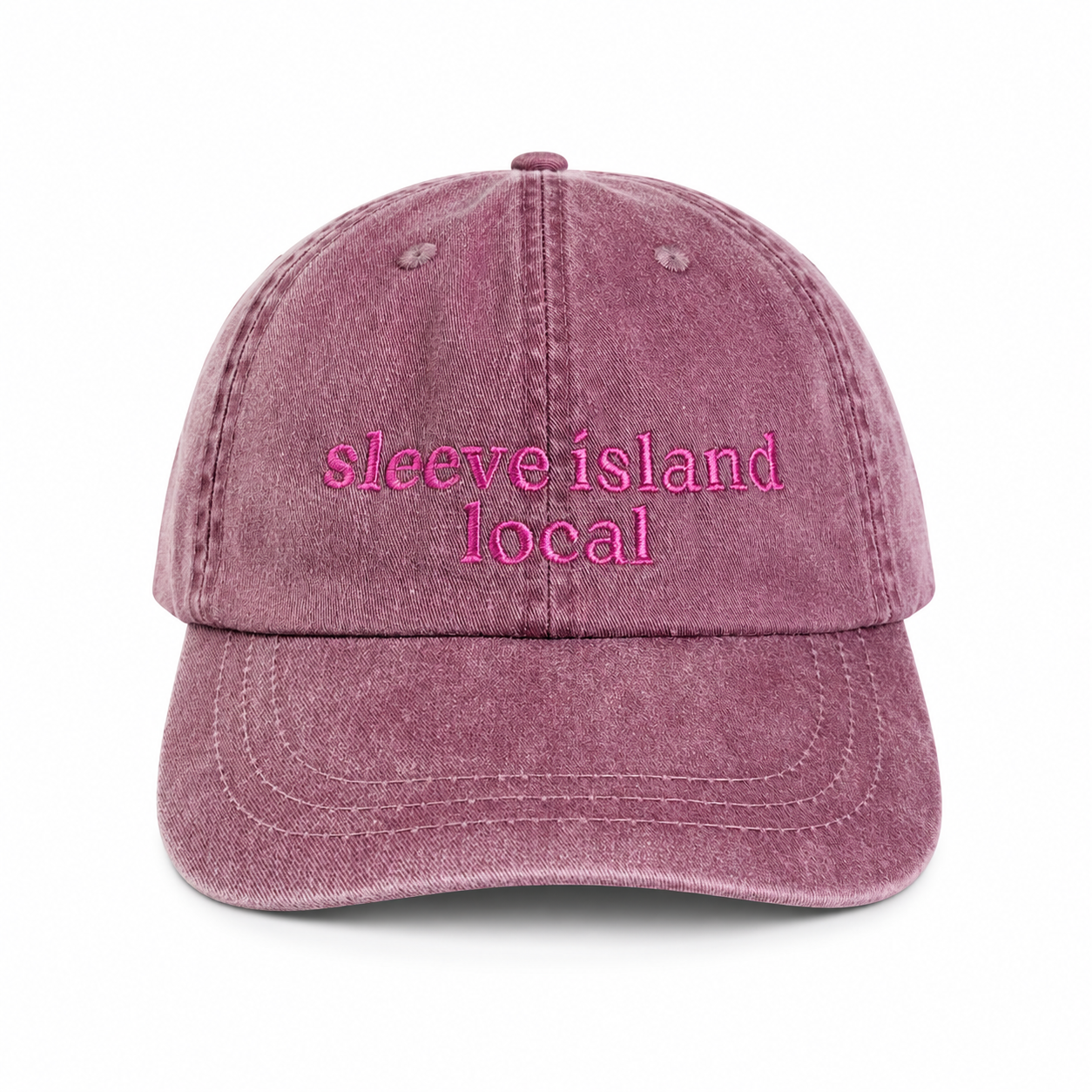 Pink denim cap with 'sleeve island local' text on a white background