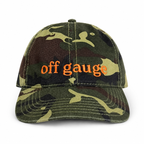 Camouflage baseball cap with 'off gauge' text on a white background