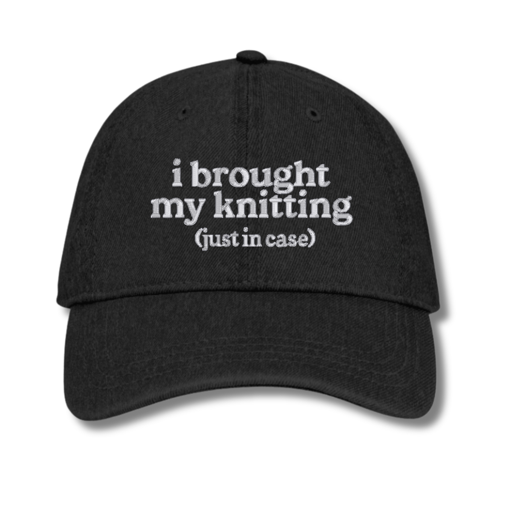 Black cap with 'resting stitch face' text on a white background