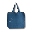 Blue tote bag with 'resting stitch face' text on a white background
