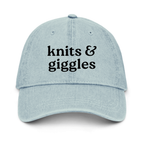 Light blue cap with 'knits & giggles' text on a white background