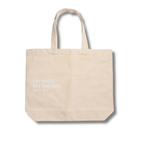 Beige tote bag with text 'i brought my knitting that is one!' on a white background