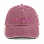 Pink cap with 'on gauge' text on a white background