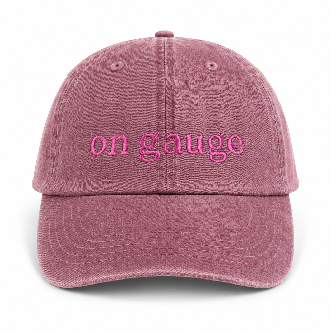 Pink cap with 'on gauge' text on a white background