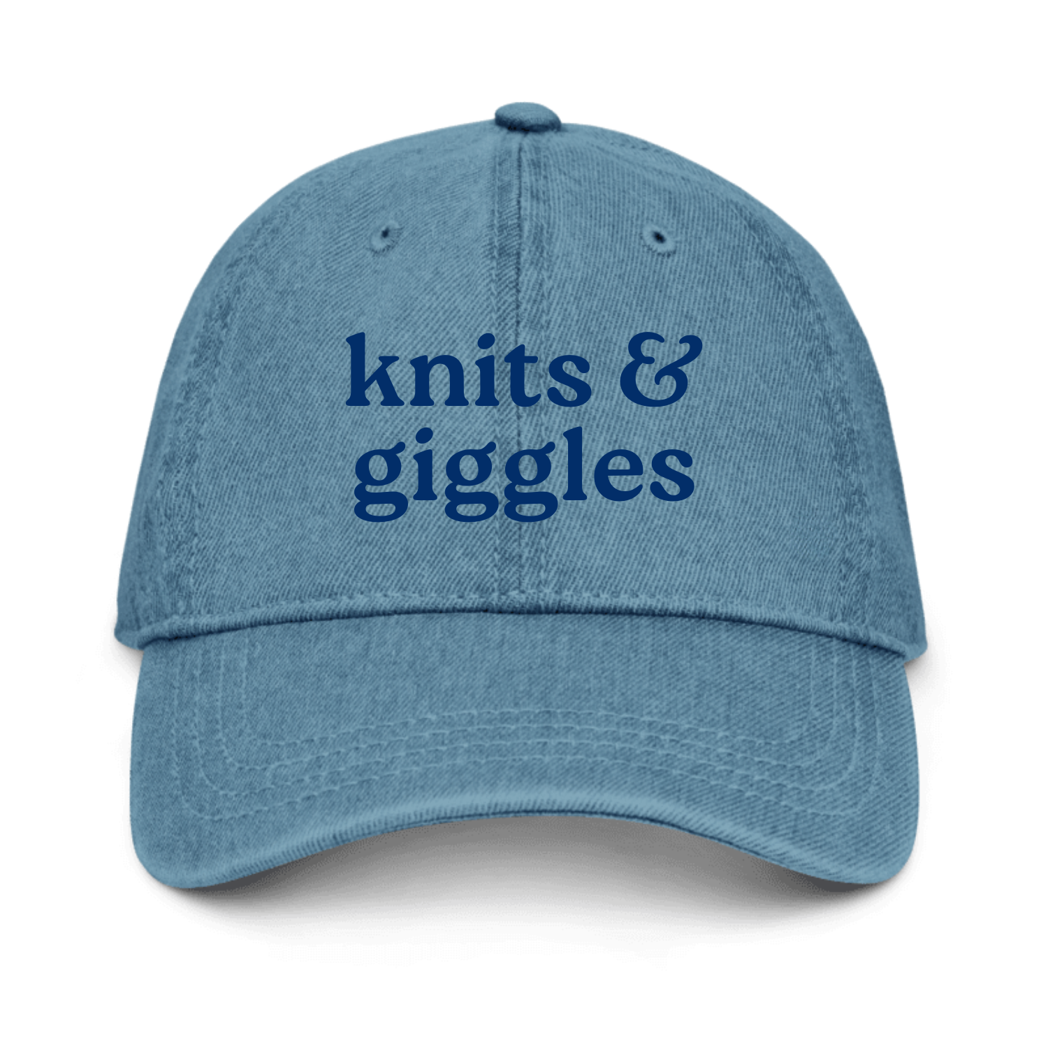 Blue denim cap with 'knits & giggles' text on a white background