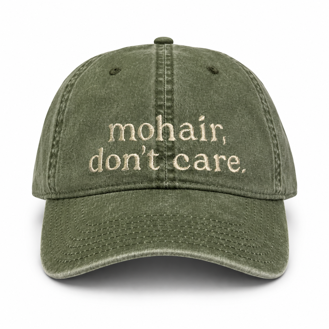 Green cap with 'mohair, don't care' text on a white background