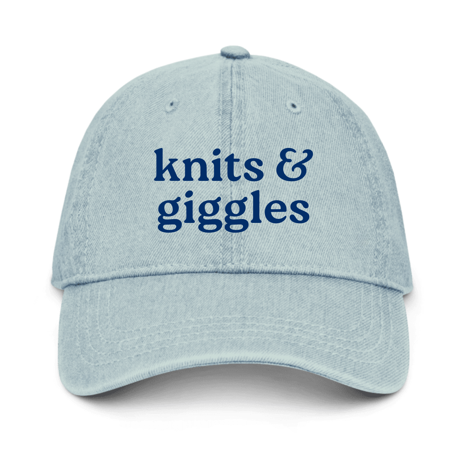 Light blue cap with 'knits & giggles' text on a white background