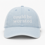 Light blue cap with 'could be worsted' text on a white background