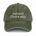 Green cap with 'natural fibers only' text on a white background