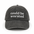 Black cap with 'could be worsted' text on a white background