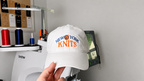 New York Knits – White Cotton Dad Hat – Blue + Orange Embroidery