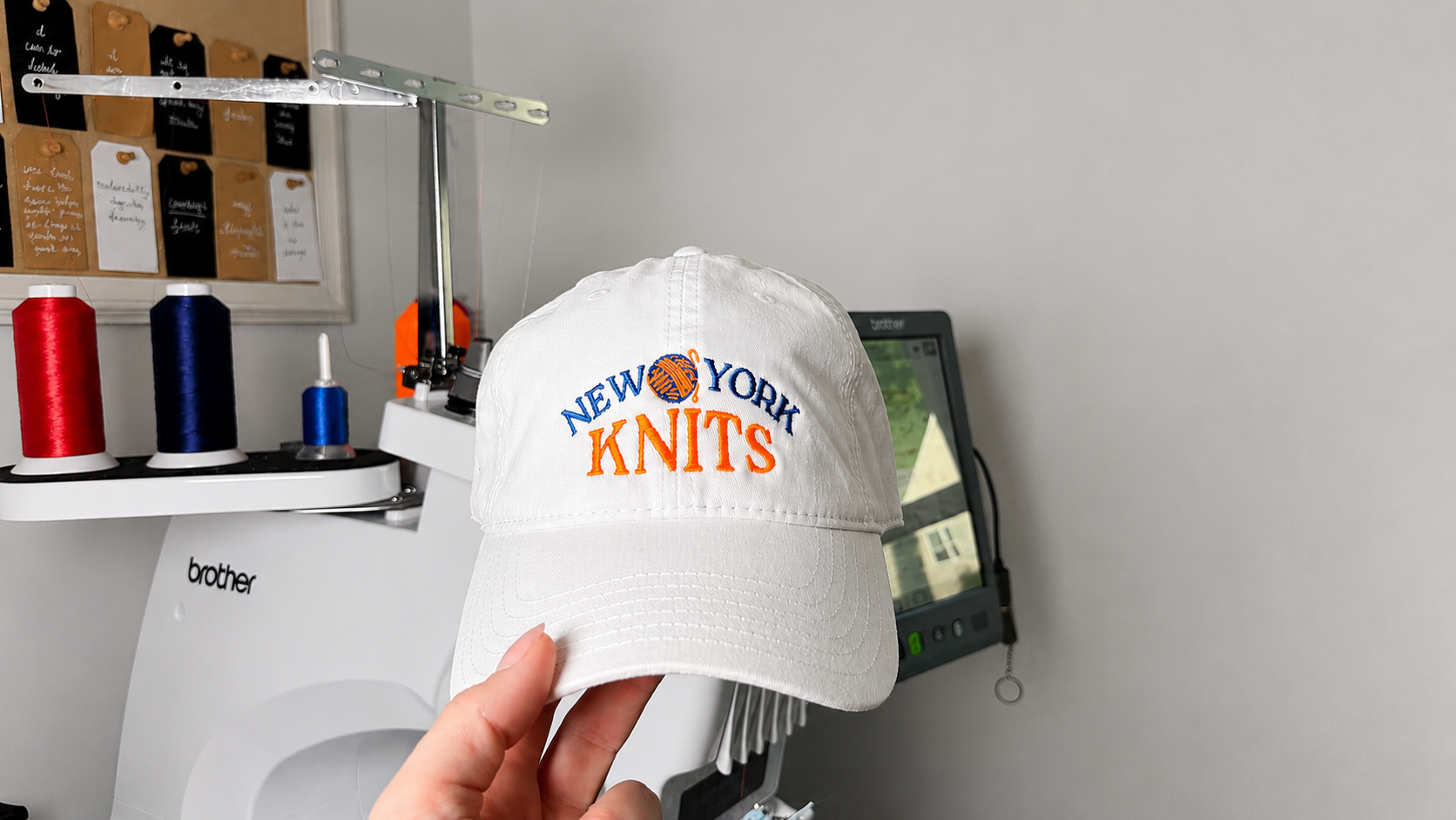 New York Knits – White Cotton Dad Hat – Blue + Orange Embroidery