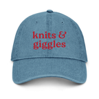 Blue cap with 'knits & giggles' text on a white background