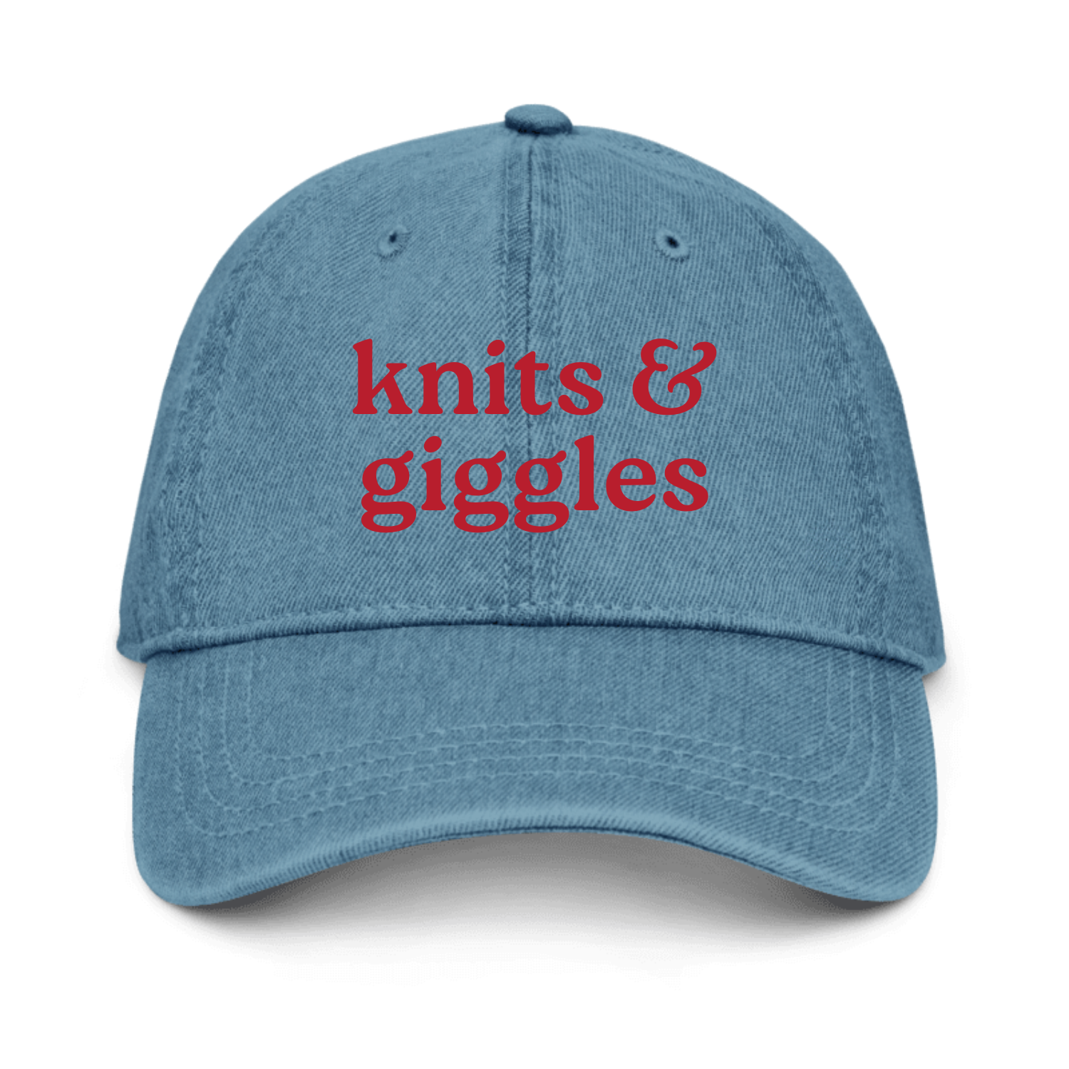 Blue cap with 'knits & giggles' text on a white background