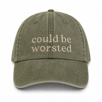 Green cap with 'could be worsted' text on a white background