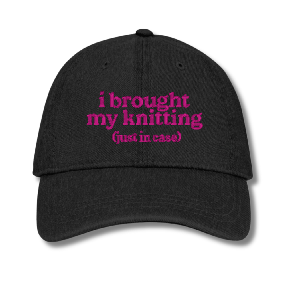 Black cap with 'resting stitch face' text in orange on a white background