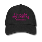 Black cap with 'resting stitch face' text in orange on a white background
