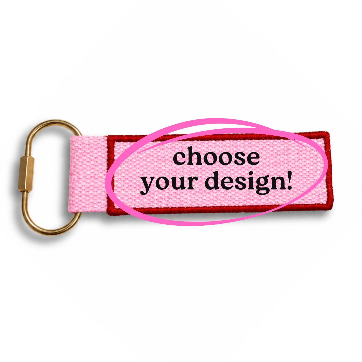 Pink keychain with gold carabiner and text 'choose your design!' on a white background