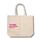 Beige tote bag with pink text on a white background
