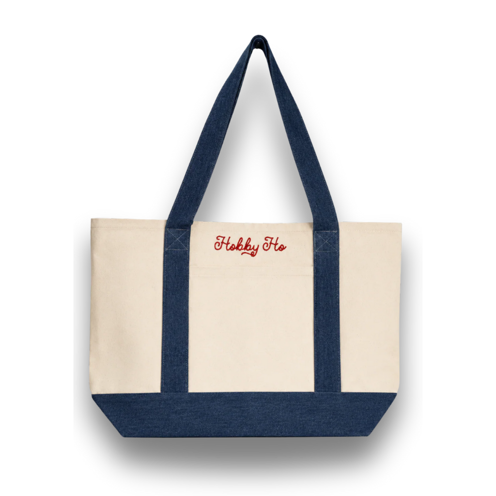 Navy and beige tote bag with 'Hobbs' branding on a white background
