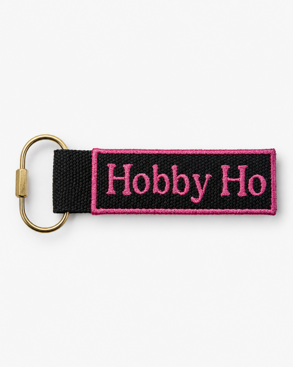 Keychain with 'Hobby Ho' text on a black strap against a white background