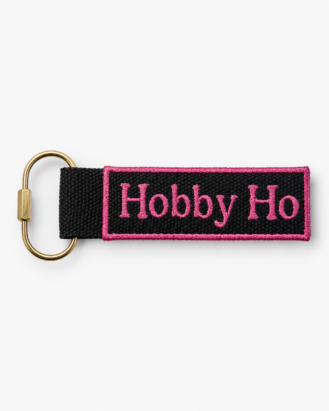 Keychain with 'Hobby Ho' text on a black strap against a white background