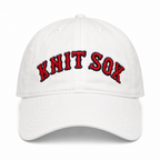 White dad hat with Knit Sox red puff embroidery and navy embroidered detail
