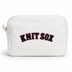 White zip pouch with red Knit Sox embroidery and navy 3D puff detail