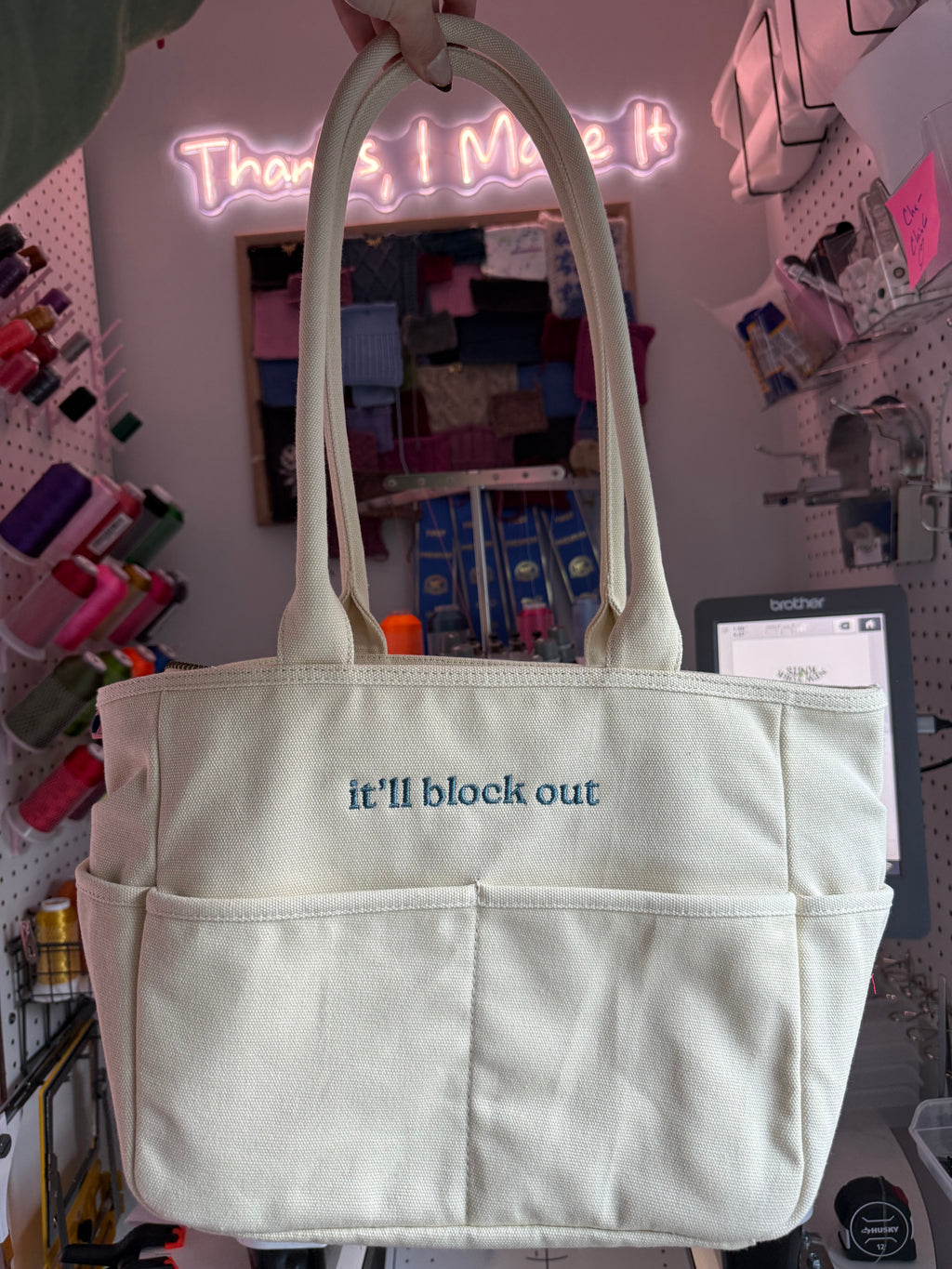 It’ll Block Out Natural Canvas TIMI Tote with slate blue embroidery