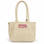 Canvas TIMI Tote with bright pink “Anti Social Knitting Club” embroidery.