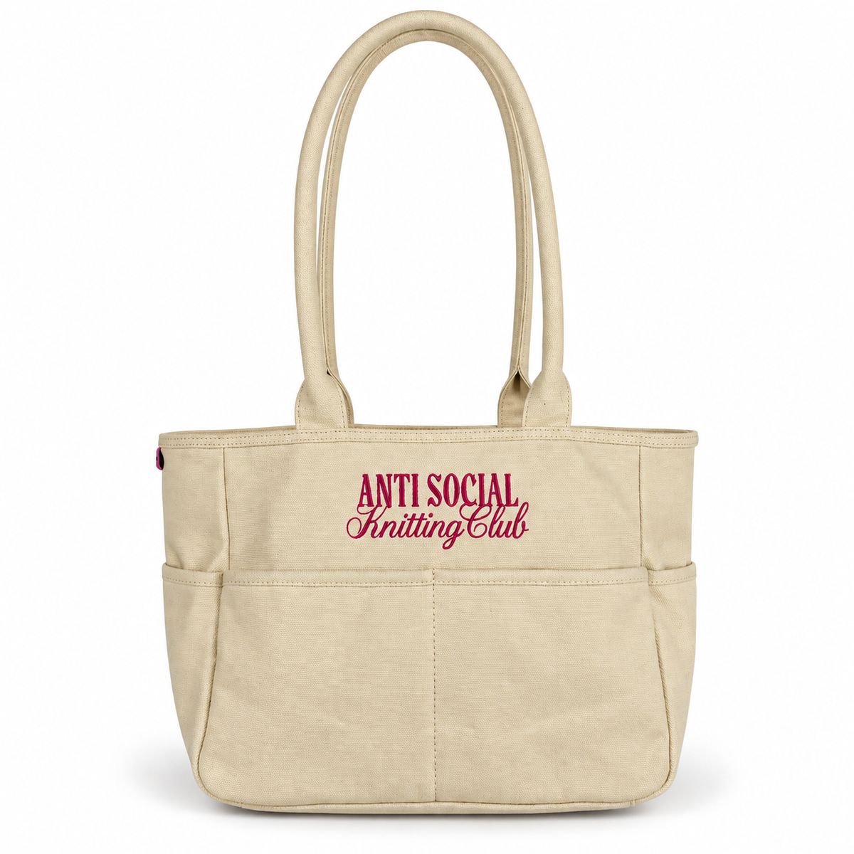Canvas TIMI Tote with bright pink “Anti Social Knitting Club” embroidery.
