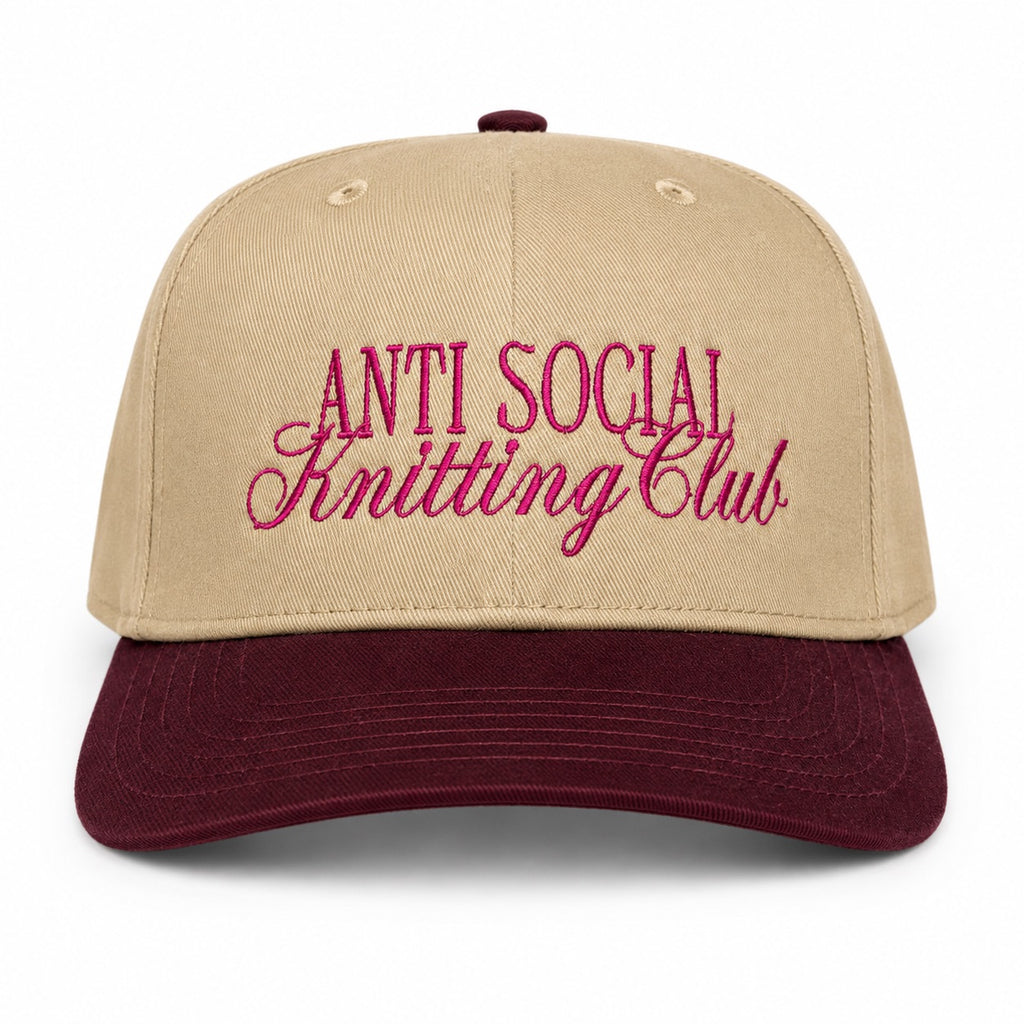 Khaki and burgundy structured hat with dark pink Anti Social Knitting Club embroidery